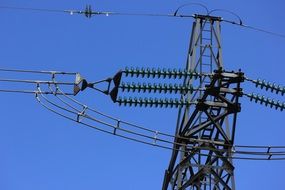 power line of a high voltage against a clear blue sky
