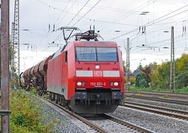 red freight train on the railway