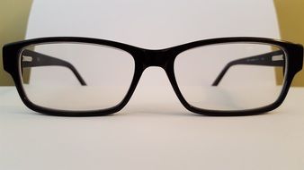 black glasses on a white sheet