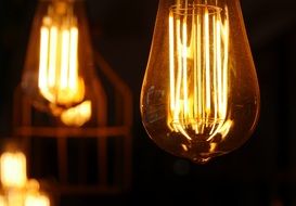 glowing bright yellow lamps in a dark
