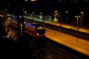 panoramic view of the train station with lights at night