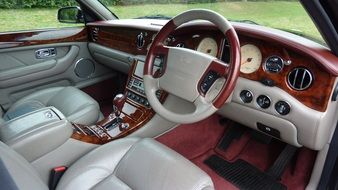 white saloon of a luxurious bentley