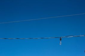 power lines against a clear blue sky