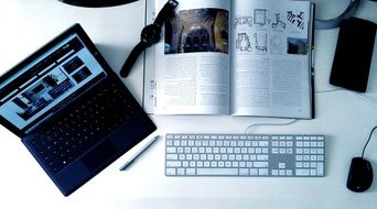 Magazine and Keyboard on Desktop