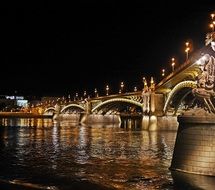lighted bridge in budapest at night