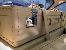 suitcase in the cabin of a luxury Mercedes