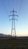 electric pole with wires against the blue sky