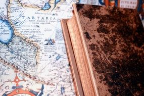 old book on the colorful vintage map