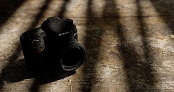 Camera With The Lense in light and shadow