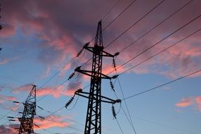 power lines against the blue sky and pink clouds