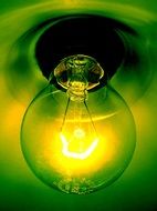 light bulb in a green chandelier close-up