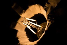 early tungsten-filament light bulb