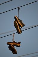 hanging boots on a electric wires