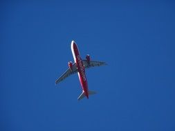 airliner in a bright blue sky