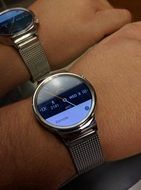 Two different watches on the hands