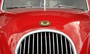 red jaguar as a classic car