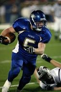 american football player in blue uniform