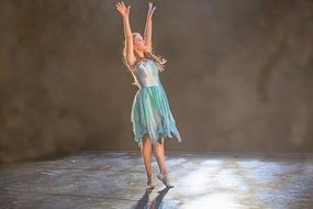 girl in a ballet dress on stage