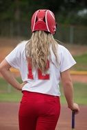 Batter, Female Softball player in red Helmet