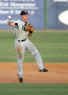 Baseball Player catches the ball
