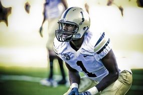 player in helmet in american football