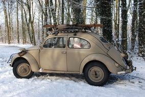 vintage car in the winter forest