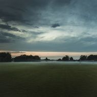 panoramic view of a soccer field in foggy haze