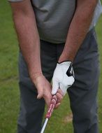 hands in golf close-up