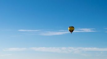 hot air balloon floating in the blue sky