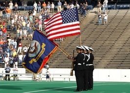 Officers with the American flag on a soccer field in Houston