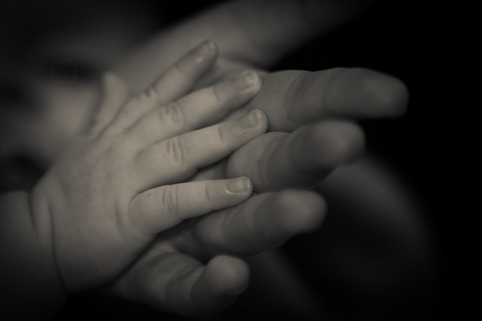 photo of baby and momâs hands