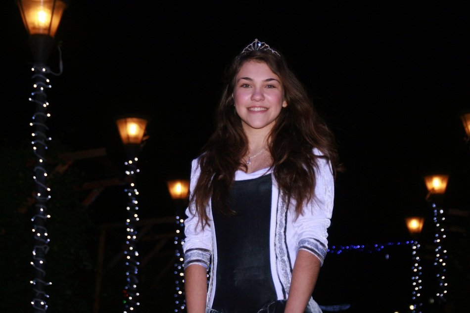 beautiful girl among christmas lights