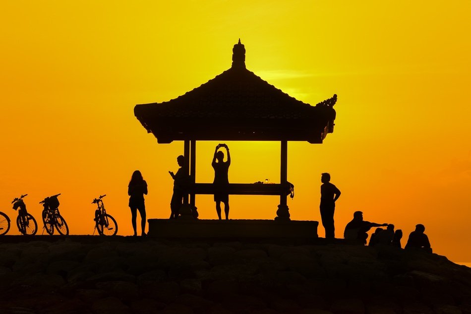 Silhouette of People and gazebo at Sunset