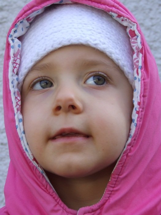 baby in pink in winter