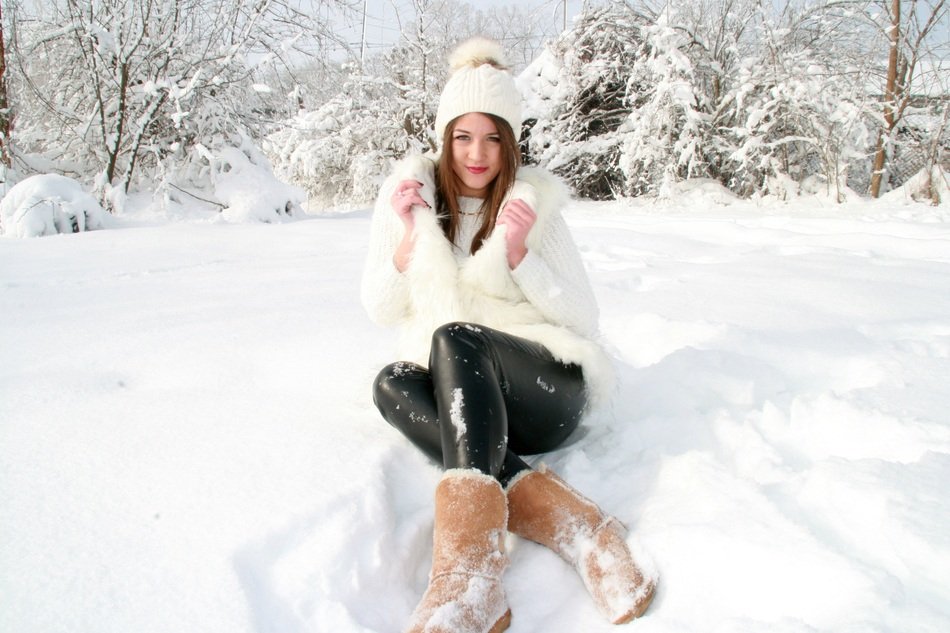 sensual girl posing among the snow