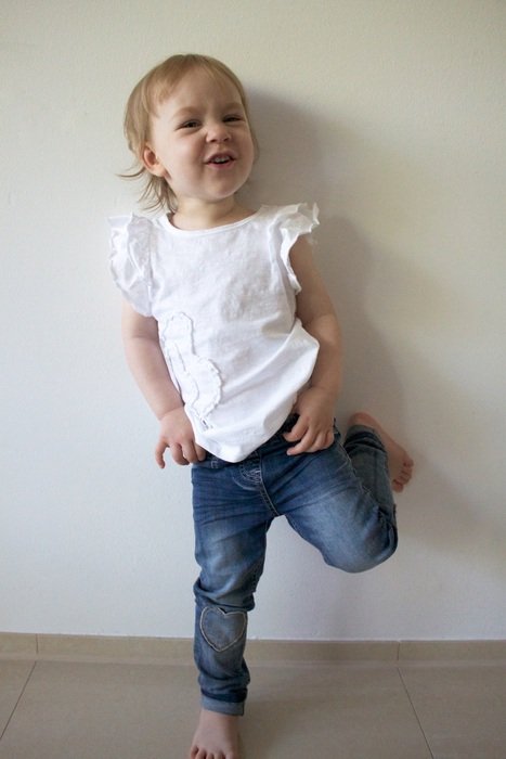 Girl in Jeans near the wall