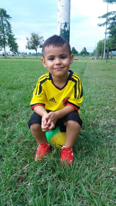 little boy on the football field