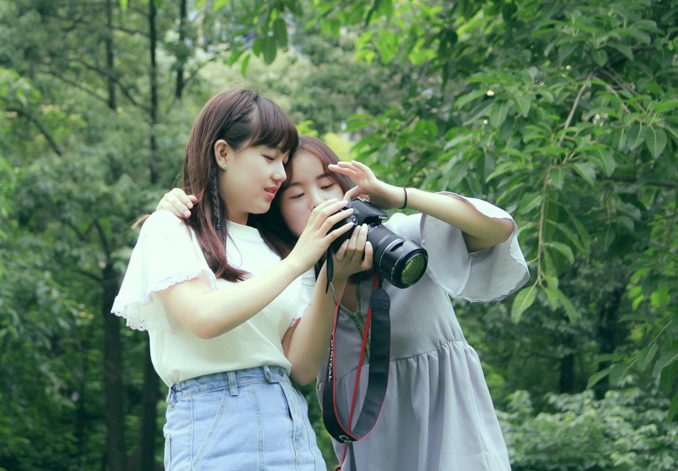 Asian girls with a camera in the park