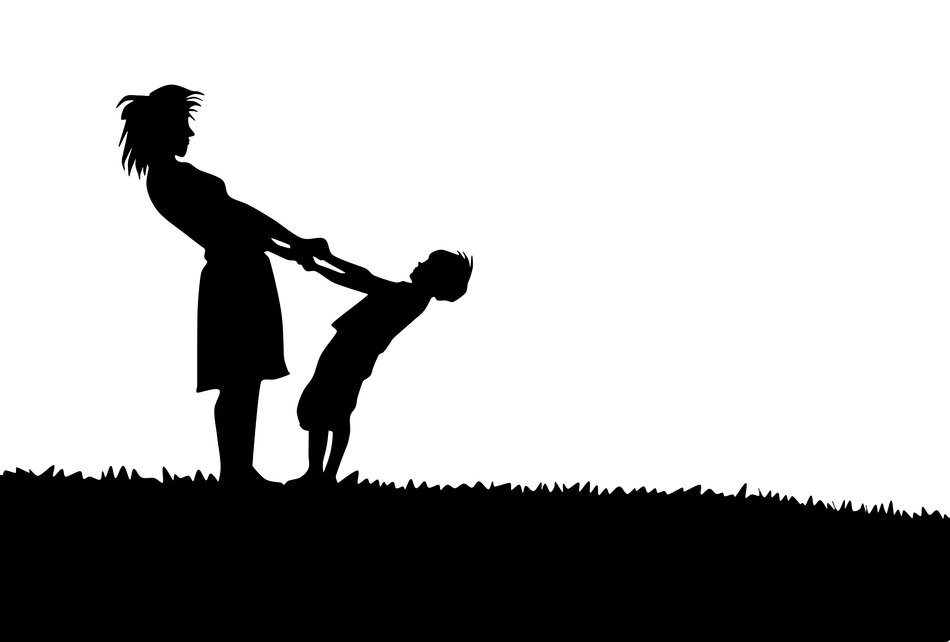 silhouette of mom and son in the meadow