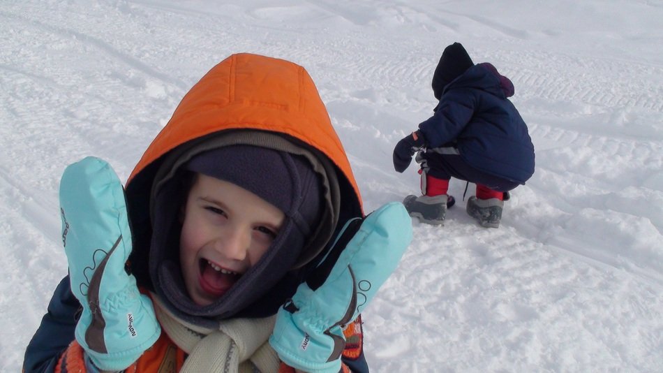 children play in the snow outside