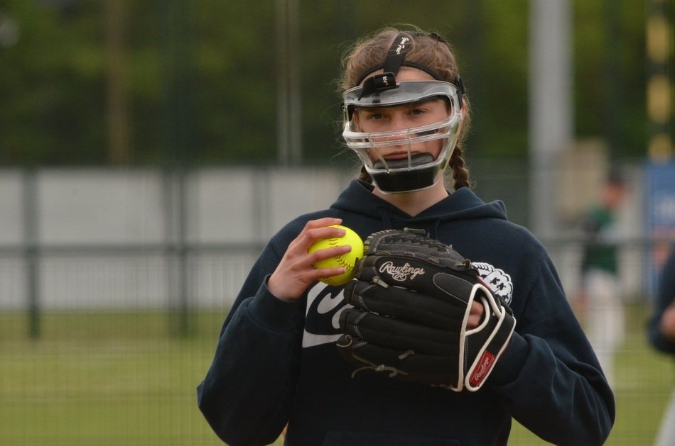 woman with a ball playing softball