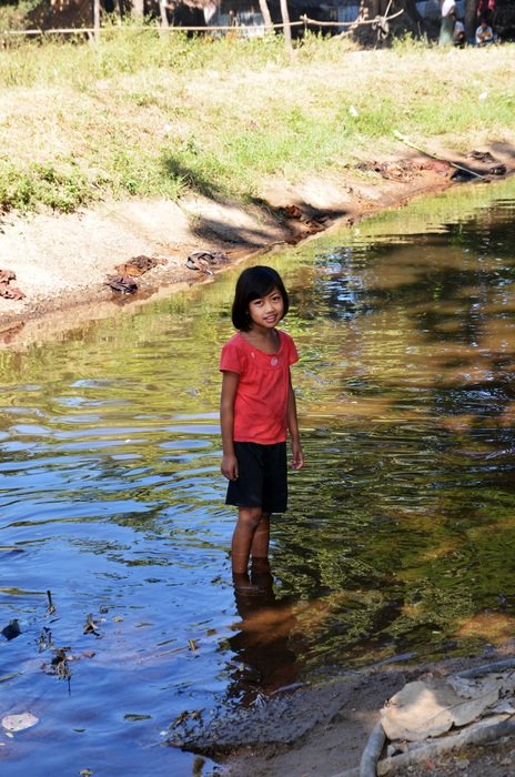 Asian child in the river