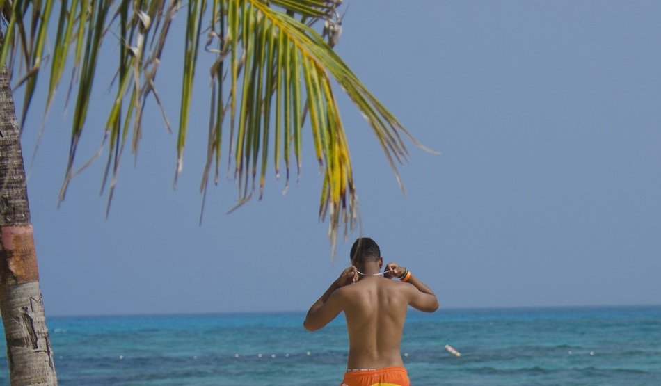 relaxing man on the blue sea background