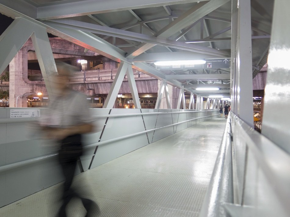 man in a shopping center Siam Discovery in a blur