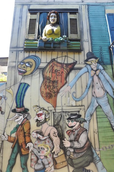 glbt Mural beneath female sculpture