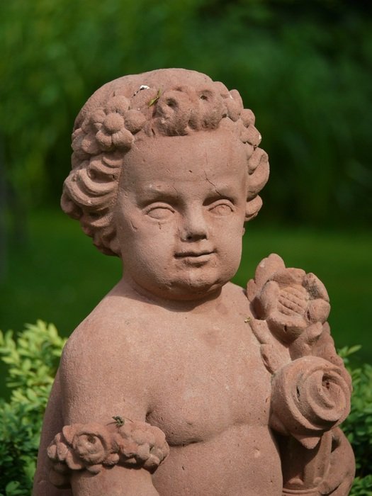 stone sculpture of a curly child