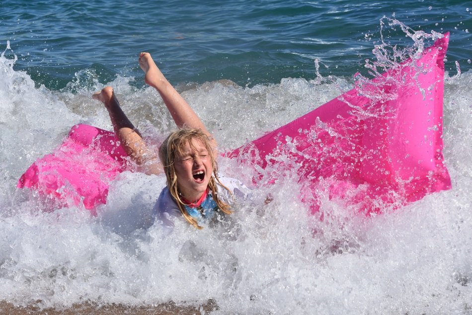 child in the waves of the ocean