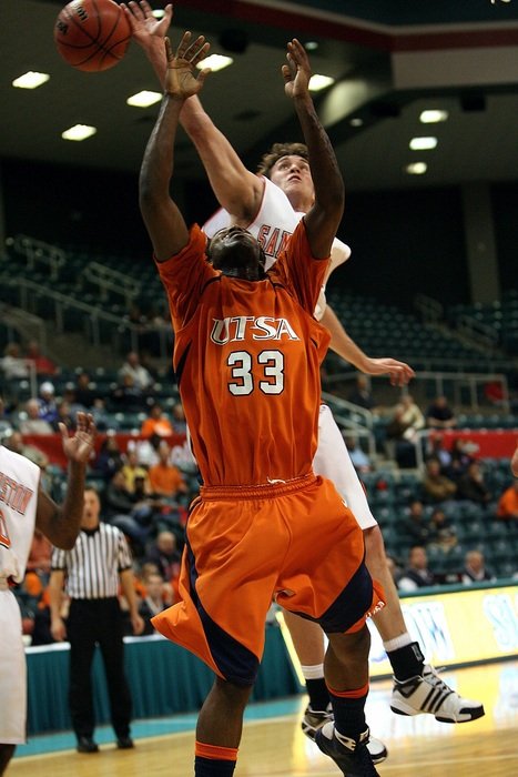 men play basketball in the hall