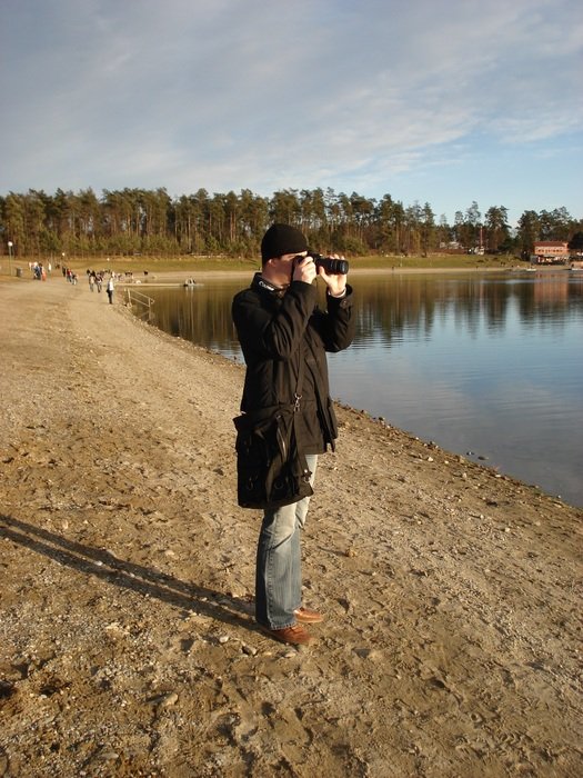 nice Man Photographer near the water