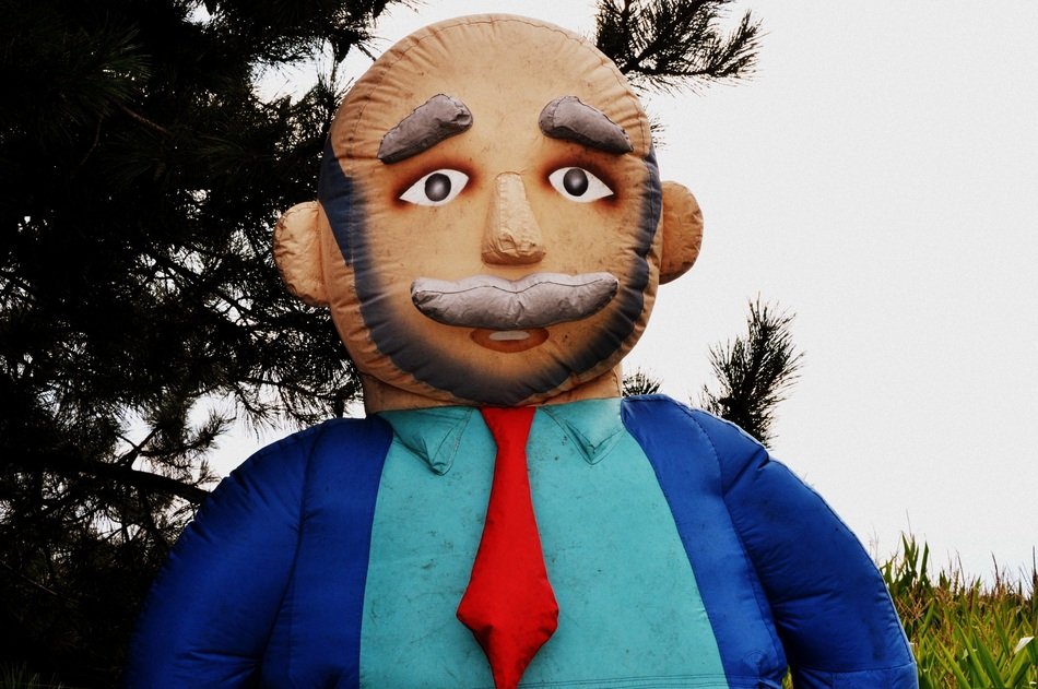 plastic sculpture of a man in a suit